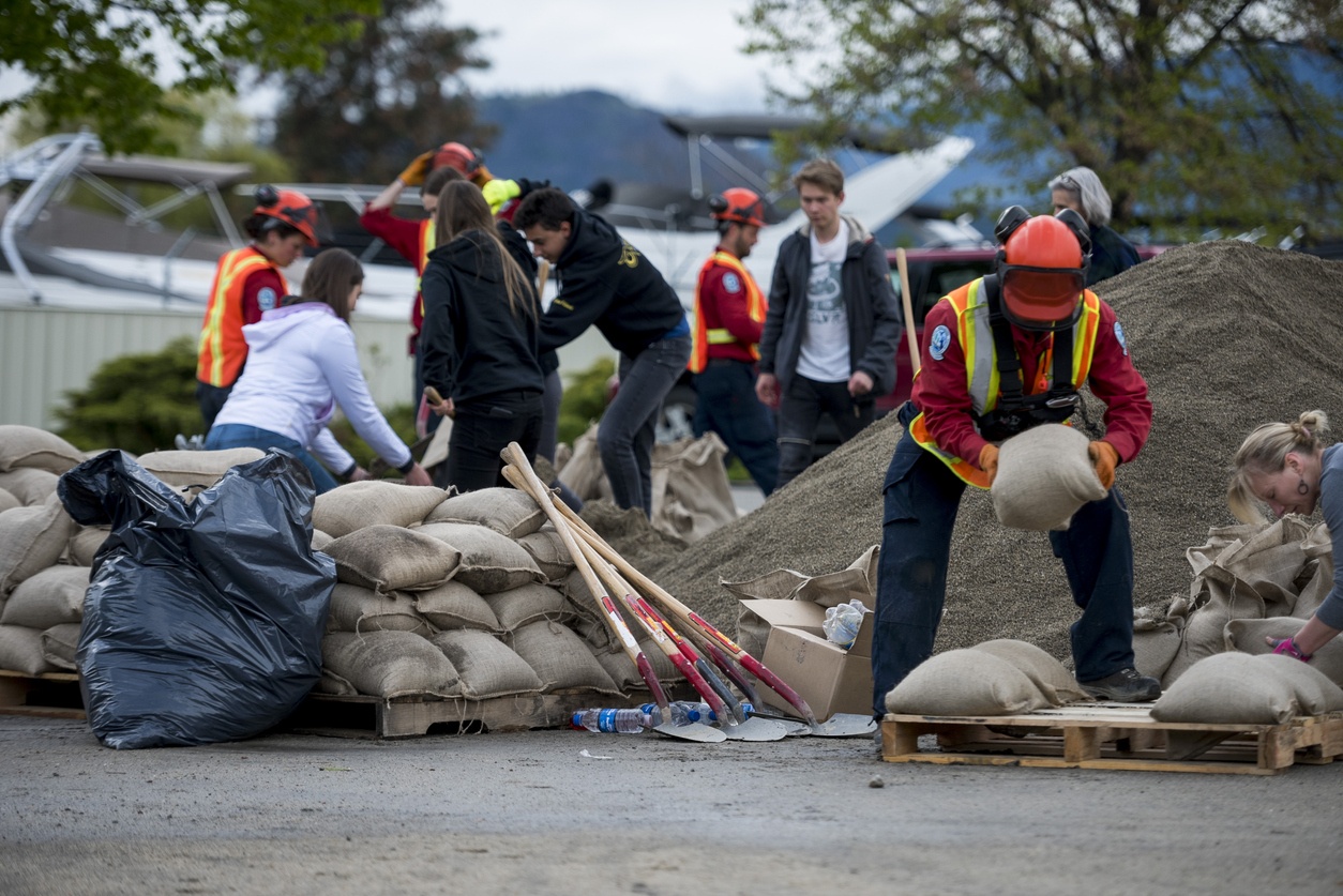 Workers and volunteers preparing for a flood