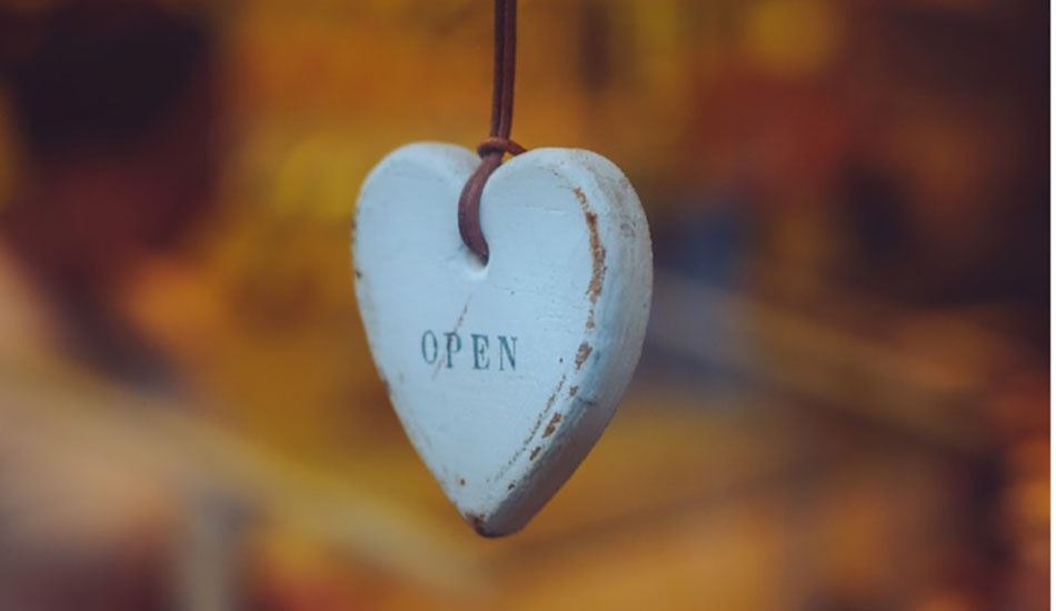 Wooden heart on string with the word "Open" on it