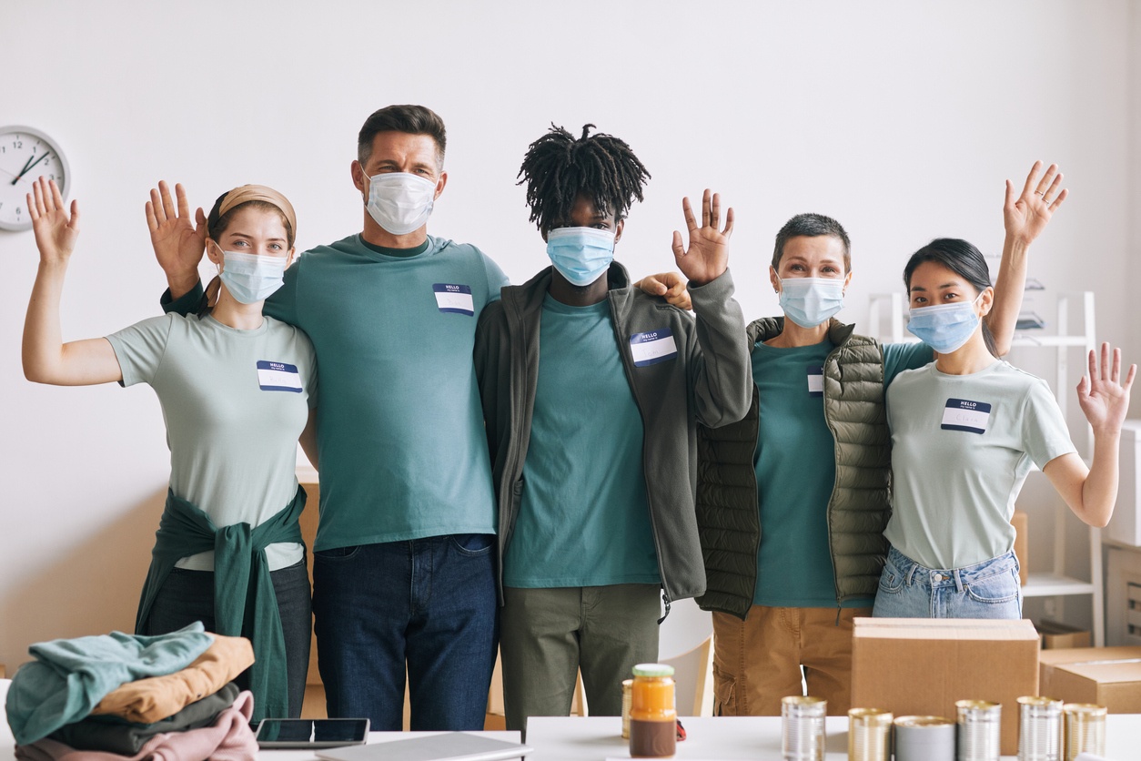 5 Volunteers with raised hands