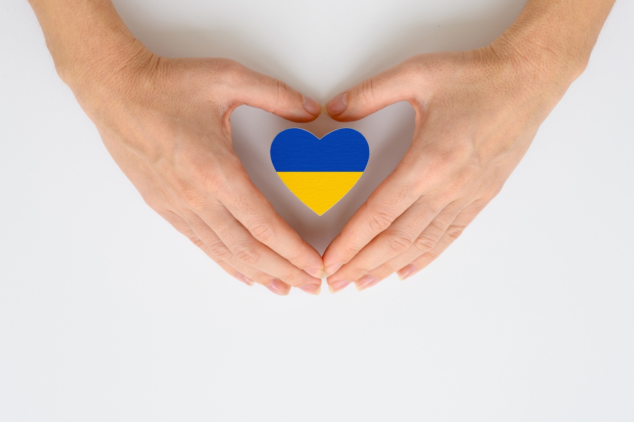 Holding heart with ukranian colors