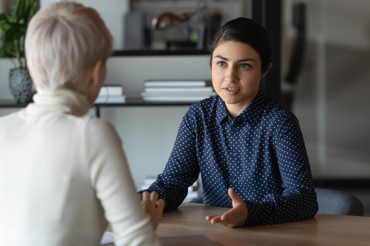 Two woman talking